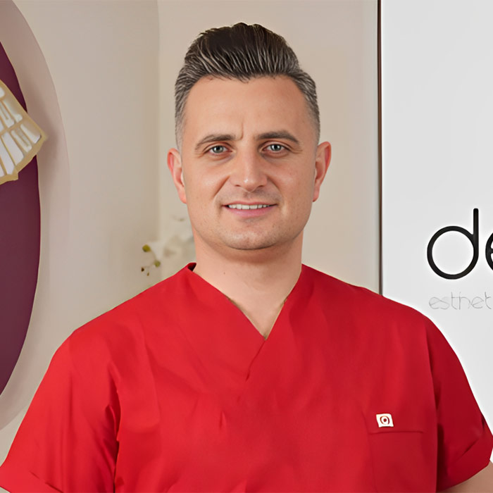 Professional portrait of Dr. Abdulkadir Narin in a luxury dental clinic setting, high-end medical lighting